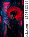 A woman in a kimono holding a red umbrella 129338314