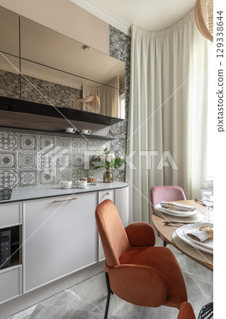 Modern Kitchen Interior with Retro Tiles and Velvet Chairs Modern Kitchen Interior with Retro Tiles and Velvet Chairs 129338644