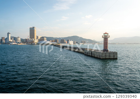 View of Takamatsu Port and the lighthouse from the sea at sunset View of Takamatsu Port and the lighthouse from the sea at sunset 129339340
