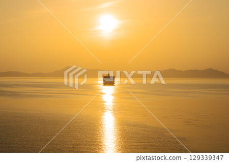 Ferry at Sunset over the Setouchi Sea, Japan Ferry at Sunset over the Setouchi Sea, Japan 129339347