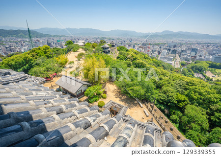 Traditional Japanese Castle Structures Overlooking Matsuyama City 129339355
