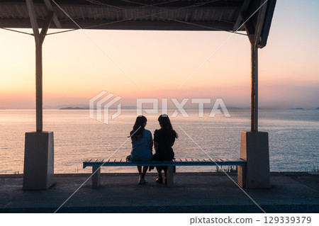 People Watching Sunset at Shimonada Station, Ehime, Japan 129339379