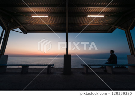 People Watching Sunset at Shimonada Station, Ehime, Japan 129339380