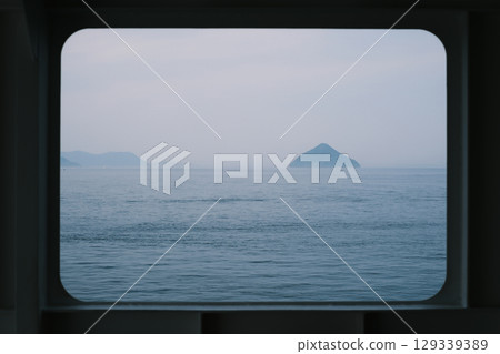 Window view on a ferry in the Seto Inland Sea, Japan Window view on a ferry in the Seto Inland Sea, Japan 129339389