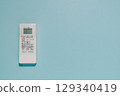 White Air Conditioner Remote Control on Blue Background, Climate Comfort 129340419