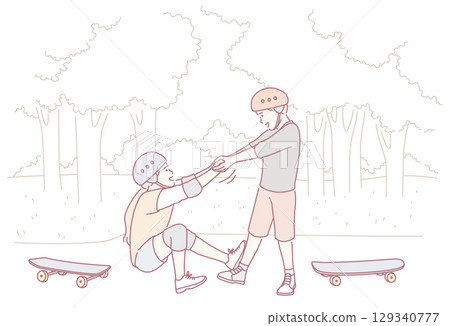 Children are enjoying learning to skateboard in a sunny park with friends and laughter 129340777
