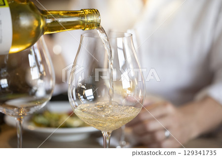 Male drinking wine 129341735