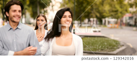 Cheating Boyfriend. Desperate Girl Meeting Her Man Dating With Other Woman Walking Outside In Park. Selective Focus 129342016