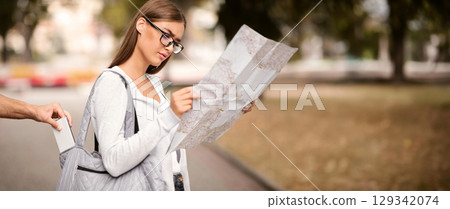 Travel Pickpocketing. Thief Stealing Smartphone From Tourist Woman's Bag Standing Outside. Cropped, Selective Focus 129342074