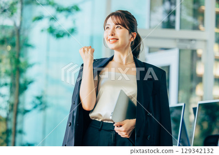 Business woman using a personal computer in the office Business woman using a personal computer in the office 129342132
