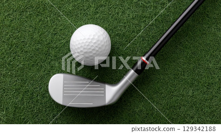 Close view of a golf ball and club resting on green grass during a sunny day 129342188