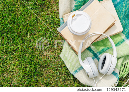 Picnic on a lawn with books and coffee 129342271