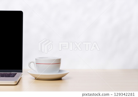 Laptop and cup of coffee on a empty copy space 129342281