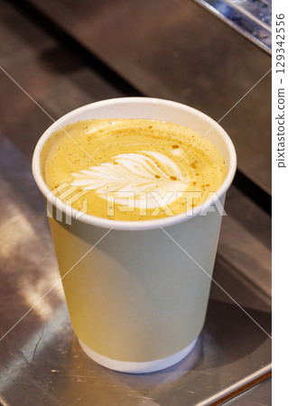 Warm cappuccino in a cup with latte art on top 129342556