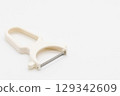 Peeler on white background 129342609
