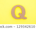 letter q on a yellow background 129342610