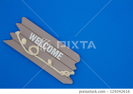 Welcome sign on blue background 129342616