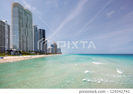 Modern skyline of Miami with towering skyscrapers, tropical vibe, and waterfront views Modern skyline of Miami with towering skyscrapers, tropical vibe, and waterfront views 129342742