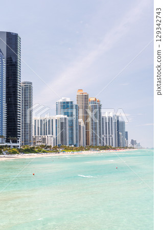 Modern skyline of Miami with towering skyscrapers, tropical vibe, and waterfront views 129342743