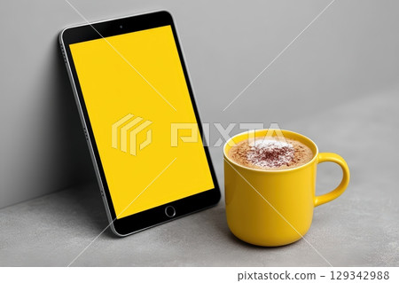Discover the perfect lead magnet eBook on a tablet beside a warm cup of coffee 129342988