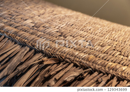 Close-Up of a Woven Thatch Surface Displaying Detailed Craftsmanship 129343699