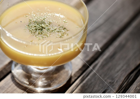 Cold corn potage with kernels in a glass cup Cold corn potage with kernels in a glass cup 129344001