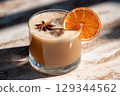 Vegan pumpkin latte with oat milk and dryed orange slice  129344562