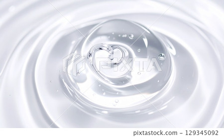 Macro photo of a swirling transparent serum High transparency and radiance Macro photo of a swirling transparent serum High transparency and radiance 129345092