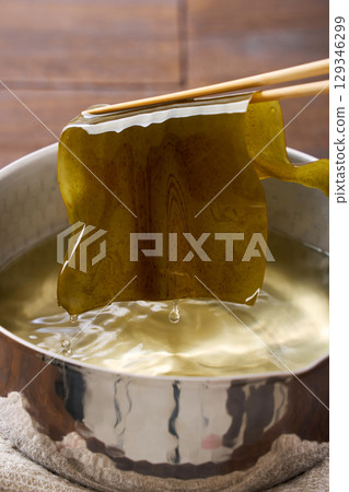 Kelp dashi | Preparation process for dashi, rehydrating kelp in a Yukihira pot Kelp dashi | Preparation process for dashi, rehydrating kelp in a Yukihira pot 129346299