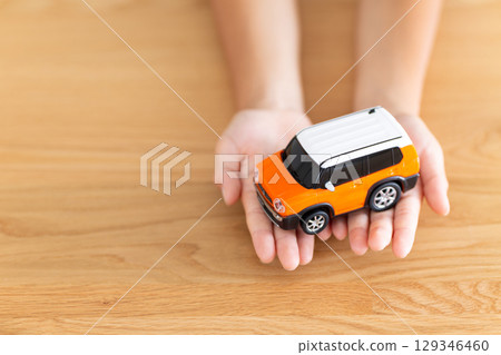 Elementary school boy holding a model car 129346460