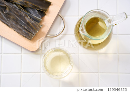 Kombu water | Kombu broth and dried kombu in a glass 129346853