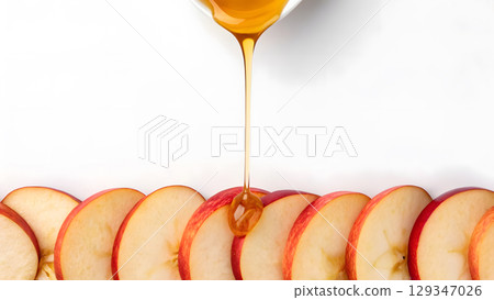 Delicious apple slices being drizzled with golden honey for a tasty treat 129347026