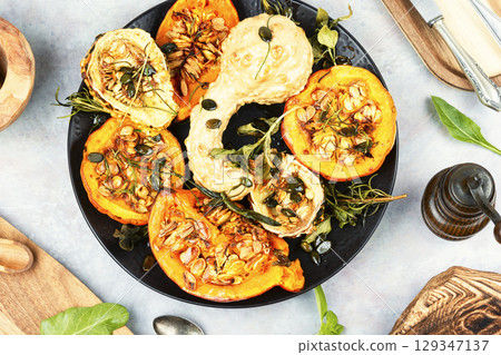 Butternut squash half with pumpkin seed. Butternut squash half with pumpkin seed. 129347137