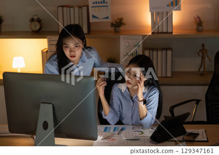 Team Support. Professionals collaborating on financial strategies while managing stress. 129347161