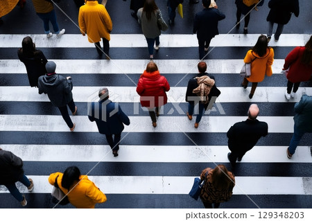 People crossing a busy city street 129348203