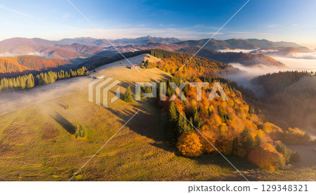 Majestic mountains dyed in autumn leaves 129348321
