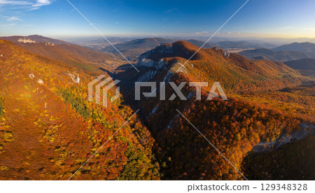 Majestic mountains dyed in autumn leaves 129348328
