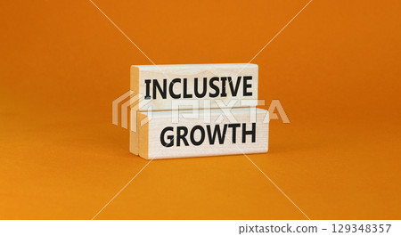 Inclusive growth symbol. Concept words Inclusive growth on beautiful wooden blocks. Beautiful orange table orange background. Business inclusive growth concept. Copy space. 129348357