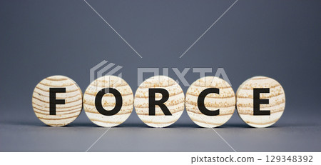 Force symbol. Concept word Force on beautiful wooden circles. Beautiful grey table grey background. Business lifestyle force concept. Copy space. Force symbol. Concept word Force on beautiful wooden circles. Beautiful grey table grey background. Business lifestyle force concept. Copy space. 129348392