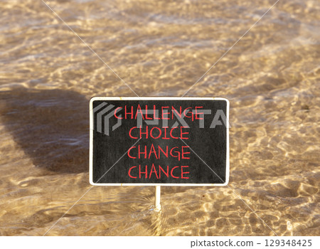 Challenge choice change chance symbol. Concept words Challenge choice change chance on beautiful blackboard. Beautiful sea water background. Business Challenge choice change chance concept. Copy space 129348425