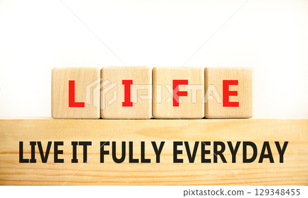 LIFE live it fully everyday symbol. Concept word LIFE Live It Fully Everyday on beautiful blocks. Beautiful white background. Business motivational LIFE live it fully everyday concept. Copy space. 129348455