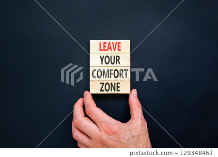 Leave your comfort zone symbol. Concept words Leave your comfort zone on beautiful wooden blocks. Beautiful black paper background. Business psychological Leave your comfort zone concept. Copy space. Leave your comfort zone symbol. Concept words Leave your comfort zone on beautiful wooden blocks. Beautiful black paper background. Business psychological Leave your comfort zone concept. Copy space. 129348461