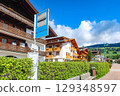 Dobbiaco / Toblach bus stop and hotels on a sunny day in Dobbiaco, BZ, Italy. May 14, 2025 129348597