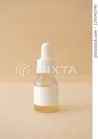 Serum bottle on beige canva background organic natural skincare beauty product mockup Serum bottle on beige canva background organic natural skincare beauty product mockup 129348740