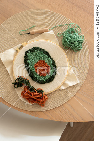 Punch needle embroidery. Trendy DIY craft hobby concept, vertical 129348743