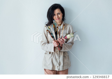 Portrait of Woman Artist Holding Brushes for Painting Portrait of Woman Artist Holding Brushes for Painting 129348817