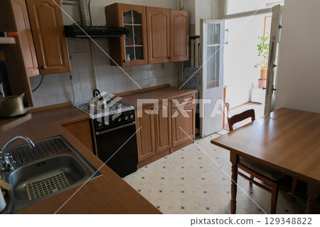 kitchen interior with stove and table 129348822