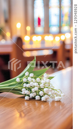Lily-of-the-valley bouquet on a church altar symbolizing chrismation Lily-of-the-valley bouquet on a church altar symbolizing chrismation 129348928