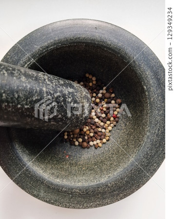 pepper in a mortar and pestle 129349234