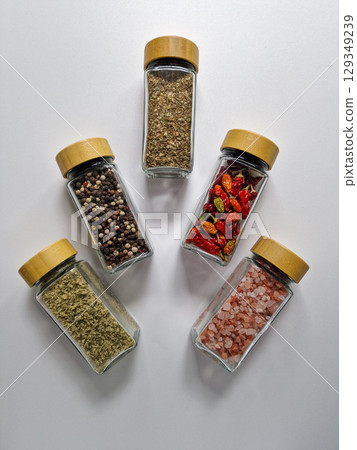 bright spices in glass jars 129349239